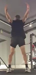 Showing a still from the Cross Arm Swing video (rear position)