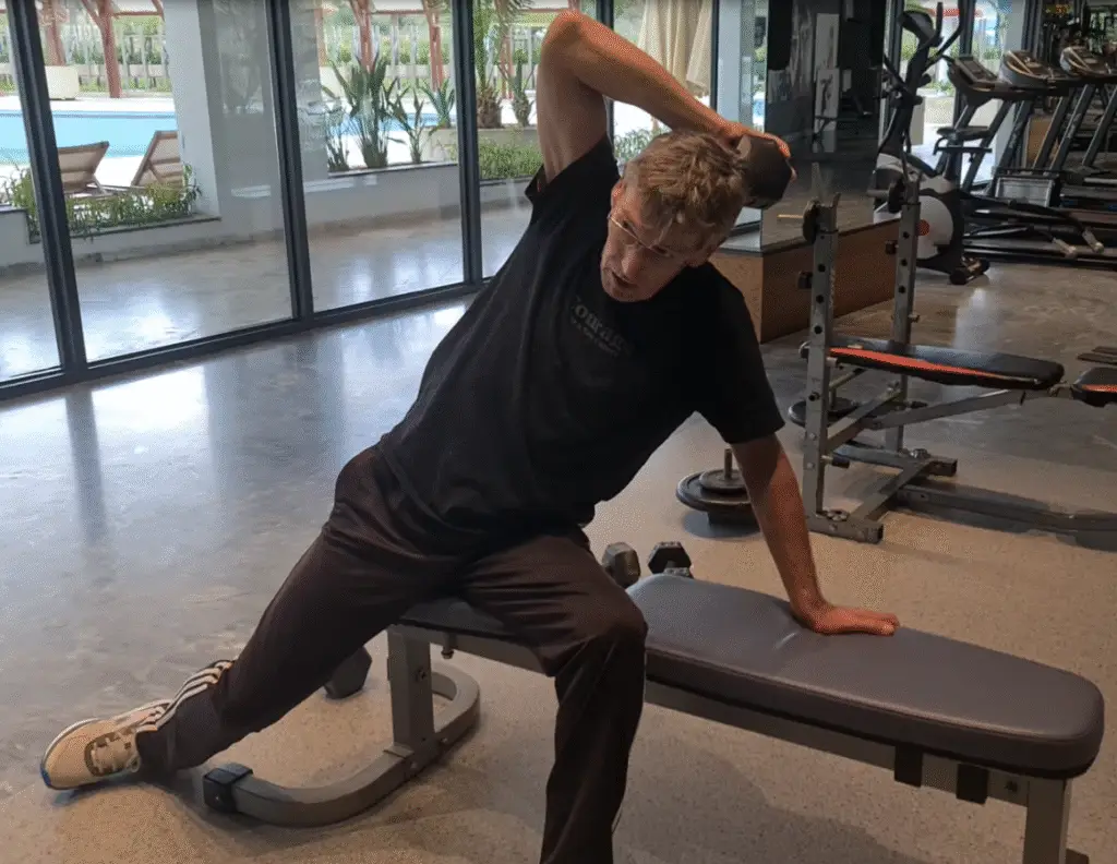 Showing my adapted version of the Tricep Backscratch exercise