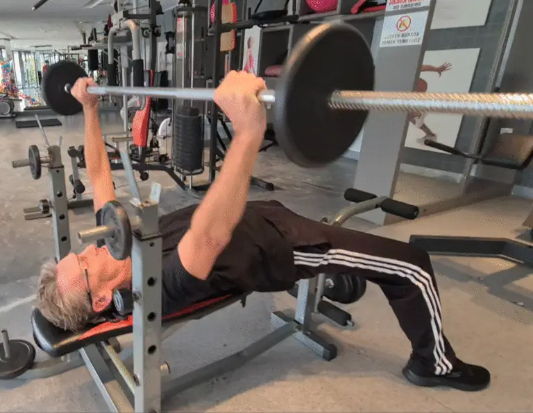 Showing a still from the Bench Press video - one of the best all-round chest exercises - - Breathing technique is crucial for correct form for the Bench Press - try doing these mixed with Bar Dips