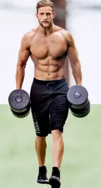 showing the farmers walk exercise with dumbbells