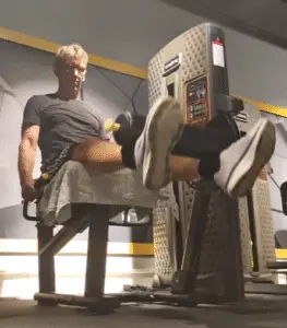 showing the leg extension gym exercise form