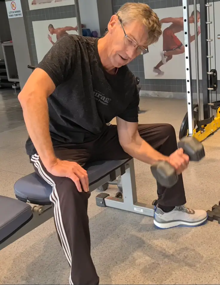 showing a still image if my Bicep Concentration Curl video using a Dumbbell - grreat for mixing with the Seated Dumbbell Curl