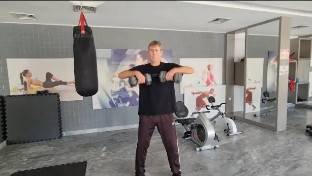 Showing the Dumbbell Upright Row