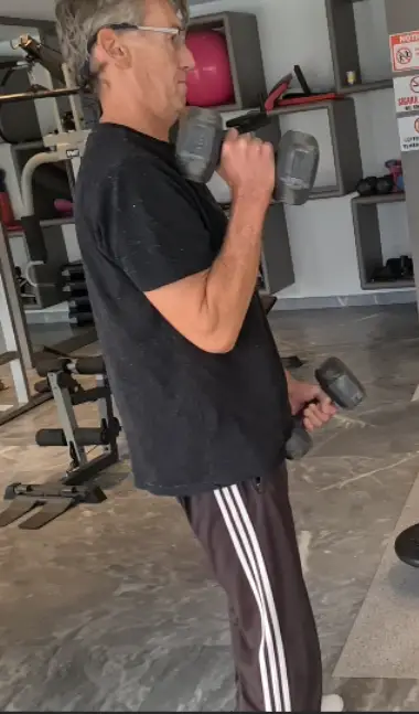 Showing the Dumbbell Hammer Curl - a Bicep exercise