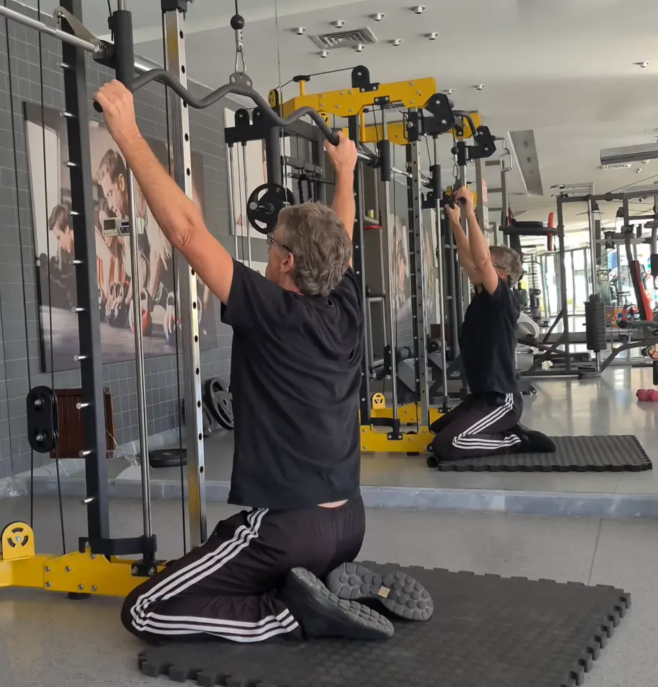 Showing the Lat Pull-Down Machine - Top Position