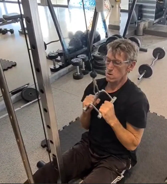 showing one of the many Pulldown exercises - using a Neutral Grip V-Bar