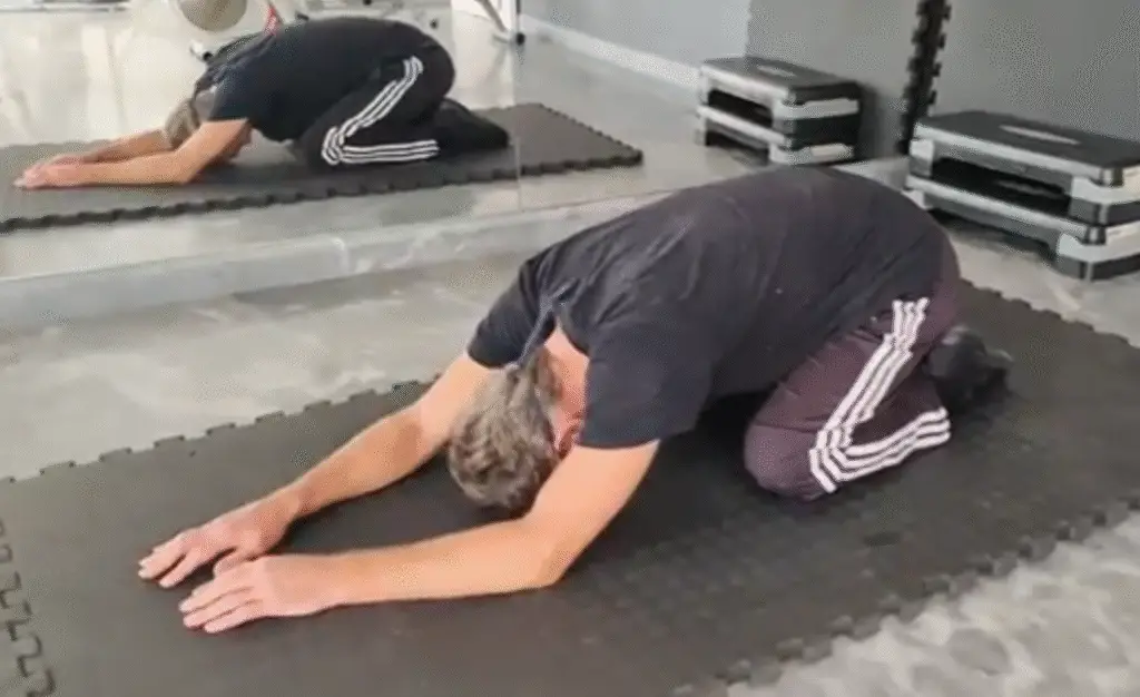 Showing the Prayer Stretch (or Child Pose) - perfect for mixing with the Cat Cow