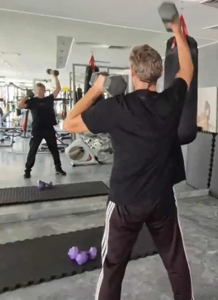 Showing the Standing Shoulder Press