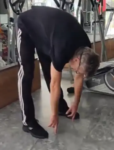 Showing the Toe Touch stretching exercise - a good compelement to the Shelf Ham stretch