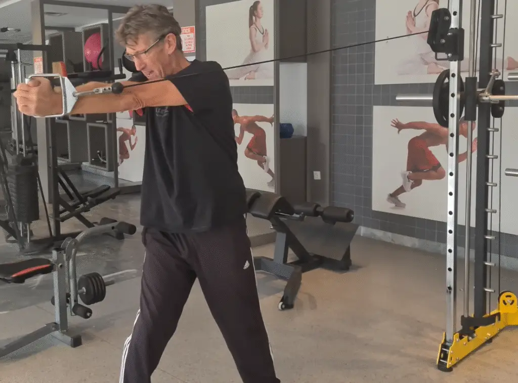Showing the Cable Oblique Twist Gym Exercise
