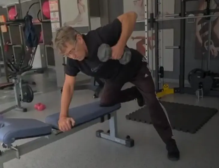 Showing a still image from the Dumbbell Bench Row video - one of my key Back Lessons