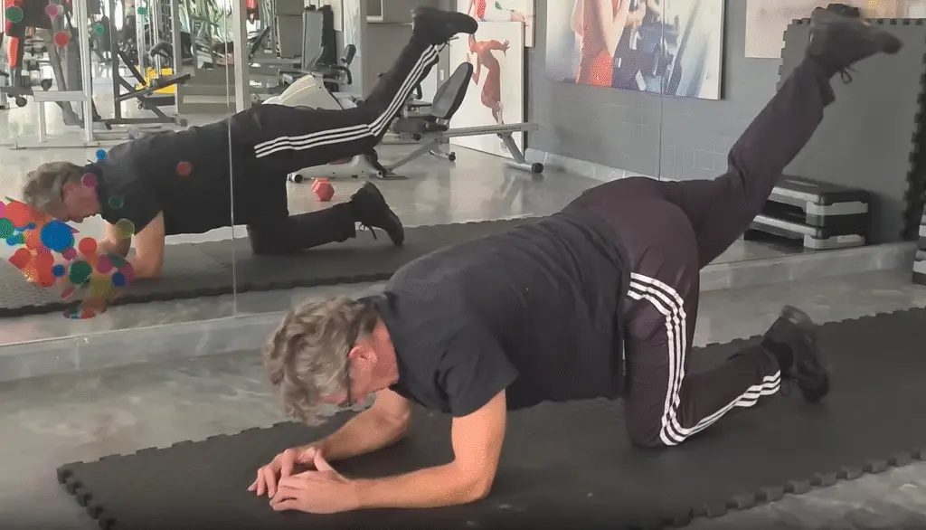 showing the Donkey Kick Pilates Exercise - one of my Intermediate Pilates Lessons
