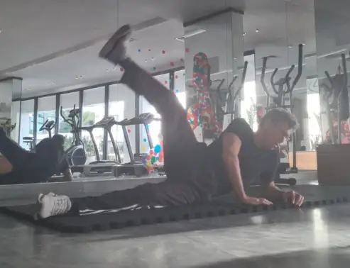 Showing the Side Lying Scissors Pilates exercise