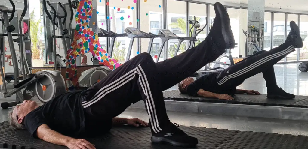 Showing Mojoh doing the Single Leg Bridge Pilates exercise