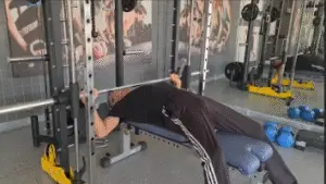 Showing a still image from the Smith Machine Press video - a gym exercise for the Chest