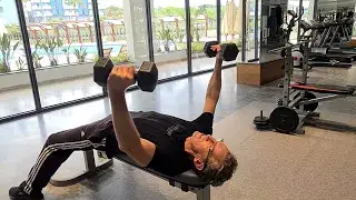 Shows a still image from the Flat Bench Dumbbell Fly exercise video for Chest muscle stretch & engagement - a good mixer for the Bar Dip exercise