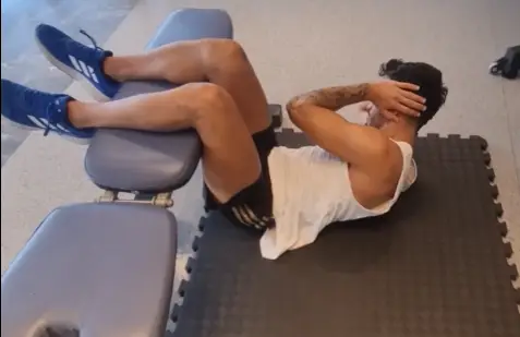 showing a still from the Bench Crunch Crossover video