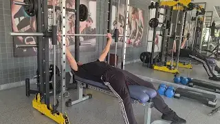 Shows the Smith Machine Press gym exercise for the Chest