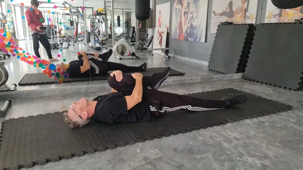 Single Knee Hug - ideal for Beginner Pilates and for people with lower back issues - usually paired with the Double Knee Hug exercise