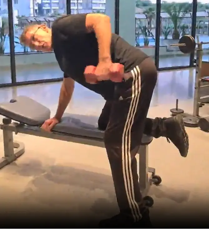 Shows a still image from my Tricep Kickback video which is a perfect example of how to use angles and levers to leverage the effectiveness of gym exercises - mix this exercise with the Tricep Pulldown