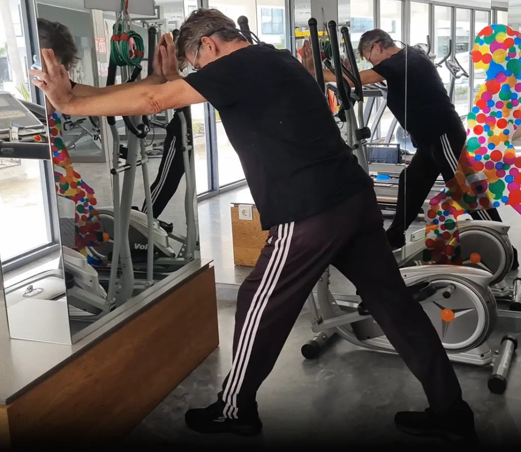 Shows a still image from my Calf Stretch video - a staple exercise for all athletes. Stretching is one of the top fundamental rules of good gym training technique