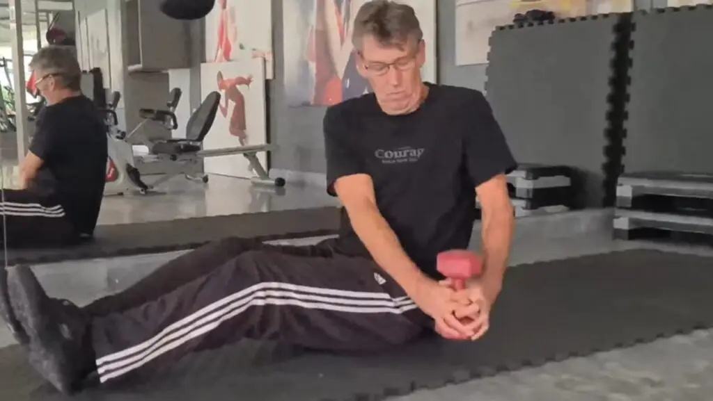 showing a still image from my Russian Twist video - an exercise for abs & core