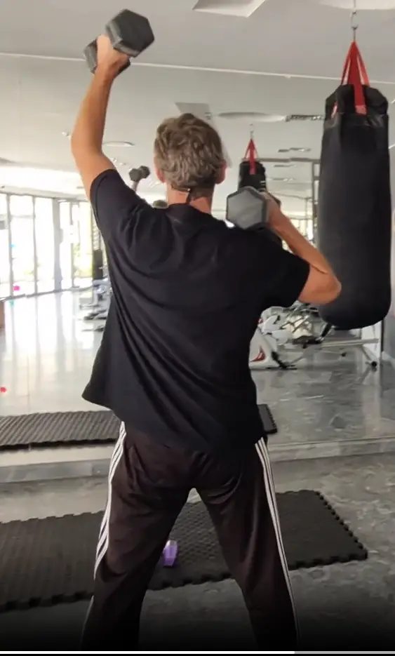shows a still image from my Standing Dumbbell Shoulder Press video