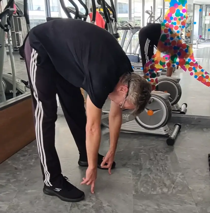 Shows a still image from my Toe Touch video - a perfect old school stretch for hams, back, and legs - should be used alongside the Raised Leg Ham Stretch