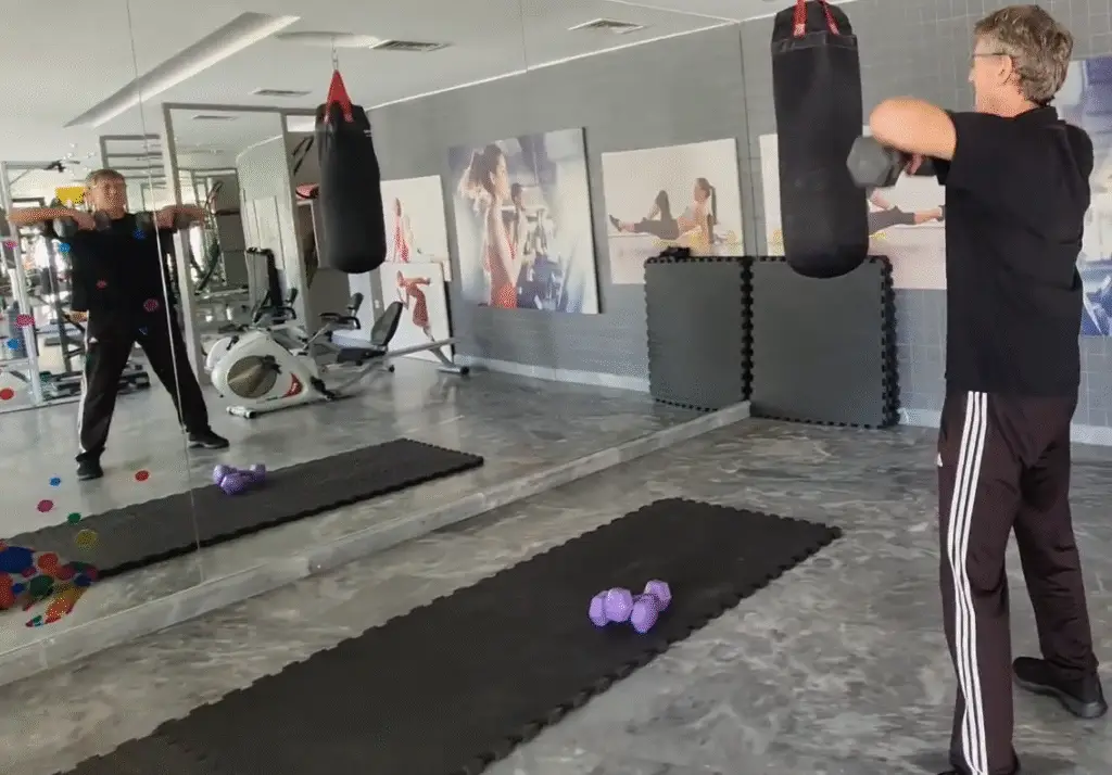 shows a still mage from my Dumbbell Upright Row video - at the top position